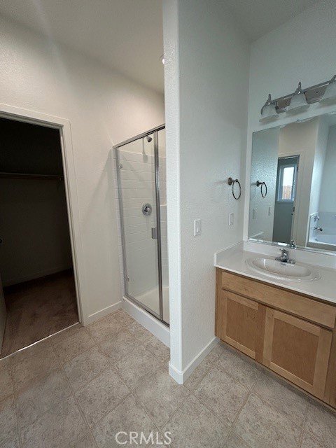 4705 Irma Drive Merced, CA 95348 - Photo 6 of 8 a bathroom with a double vanity sink and mirror