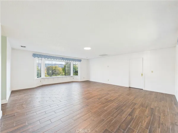 a kitchen with white cabinets and a stove