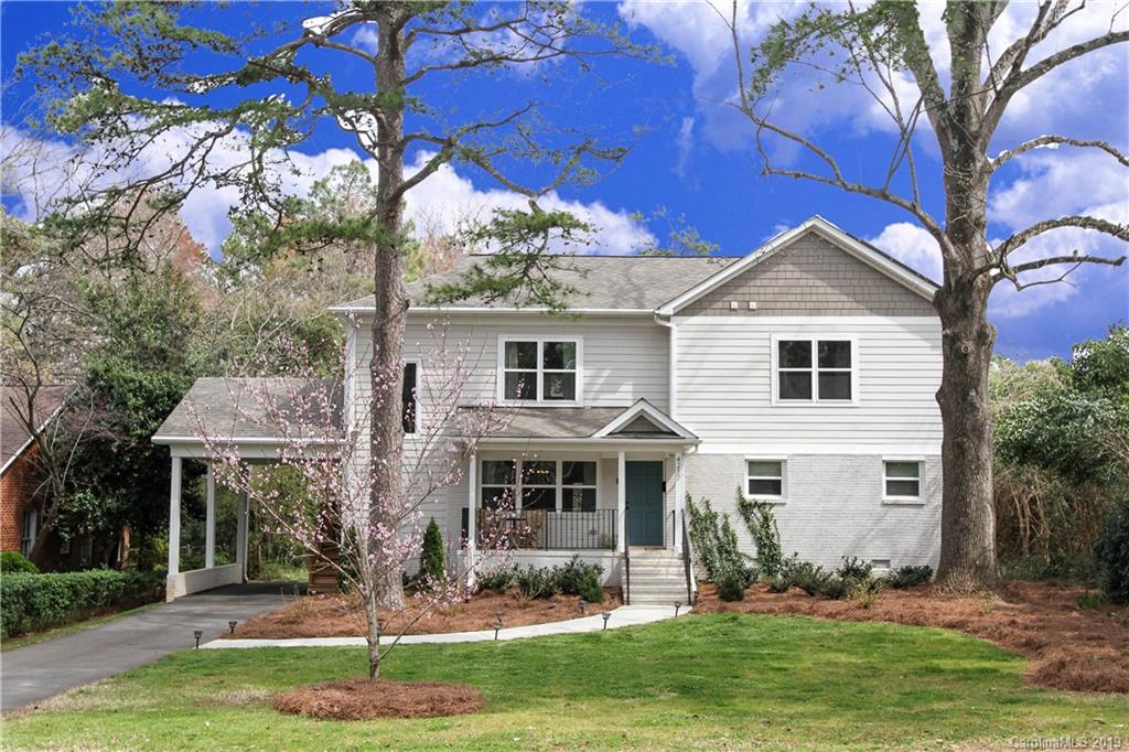 4217 Walker Road Charlotte, NC 28211 - Photo 1 of 34 a front view of a house with a yard