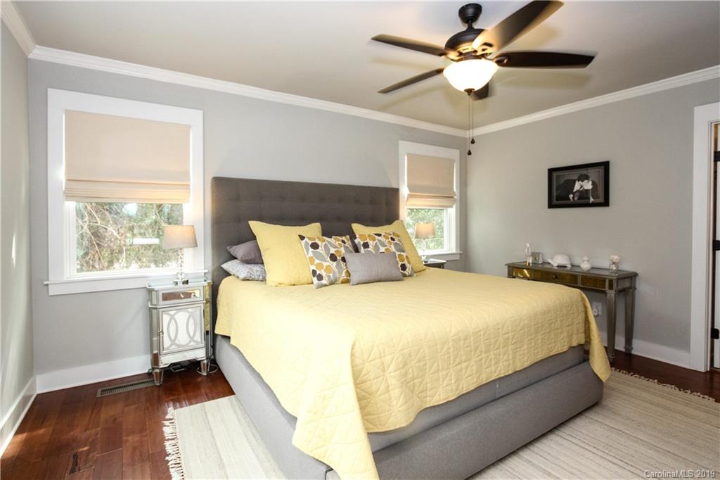 4217 Walker Road Charlotte, NC 28211 - Photo 14 of 34 a large bed sitting in a bedroom next to a window