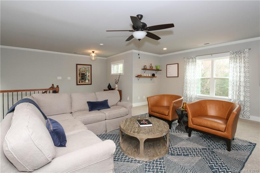4217 Walker Road Charlotte, NC 28211 - Photo 24 of 34 a living room with furniture and a large window