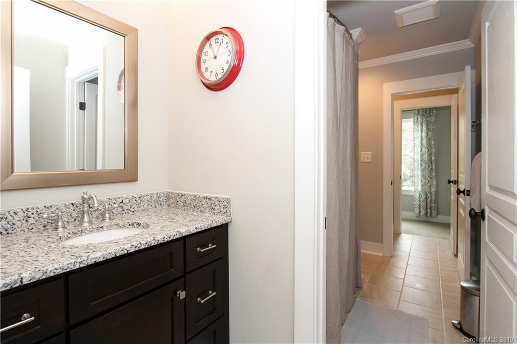 4217 Walker Road Charlotte, NC 28211 - Photo 28 of 34 a bathroom with a sink and a mirror