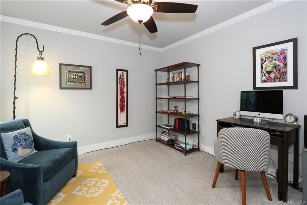 4217 Walker Road Charlotte, NC 28211 - Photo 30 of 34 a living room with furniture and a flat screen tv