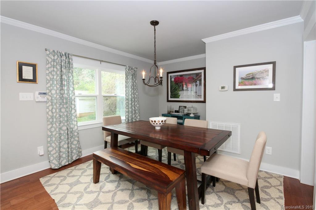 4217 Walker Road Charlotte, NC 28211 - Photo 6 of 34 a view of a dining room with furniture window and wooden floor
