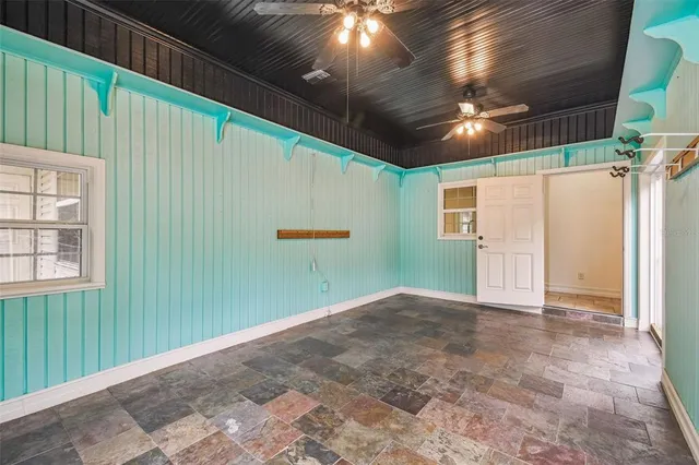 a view of a livingroom with furniture and a flat screen tv