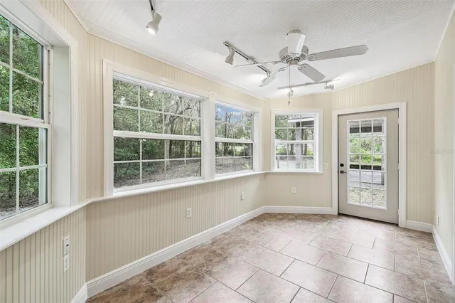 a bathroom with a bathtub and mirror