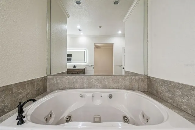 a view of an house with backyard space and balcony