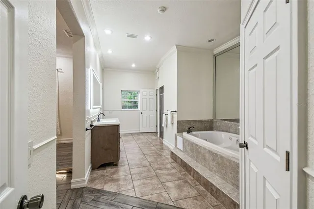 a front view of a house with a yard and swimming pool