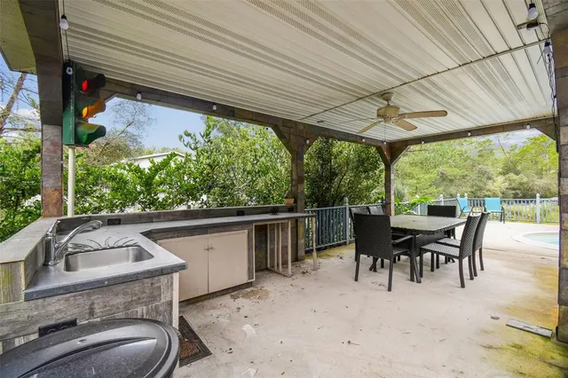 a view of a house with backyard and porch