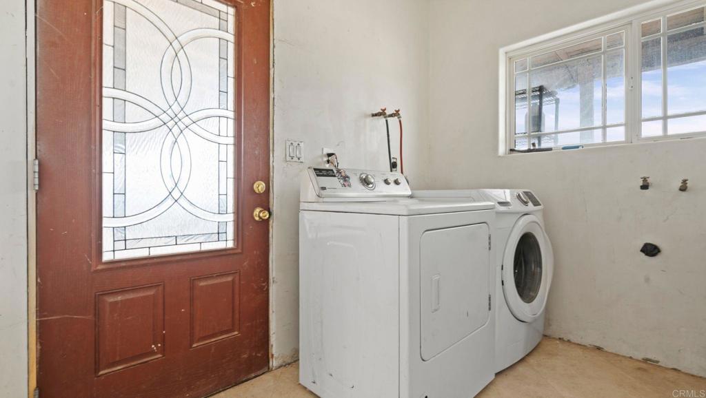 45620 Lewis Valley Road Hemet, CA 92544 - Photo 12 of 53 a utility room with dryer and washer