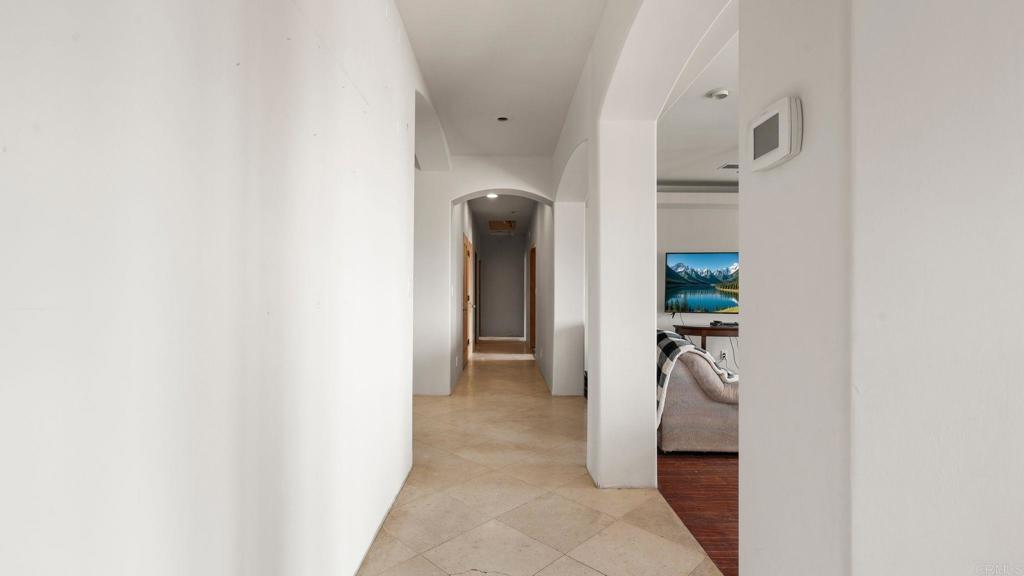 45620 Lewis Valley Road Hemet, CA 92544 - Photo 14 of 53 a view of a hallway with closet and a black gate