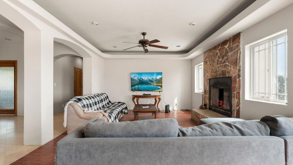 45620 Lewis Valley Road Hemet, CA 92544 - Photo 17 of 53 a living room with furniture and a fireplace
