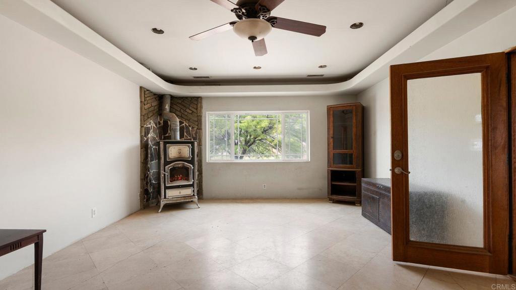 45620 Lewis Valley Road Hemet, CA 92544 - Photo 21 of 53 an empty room with windows and closet