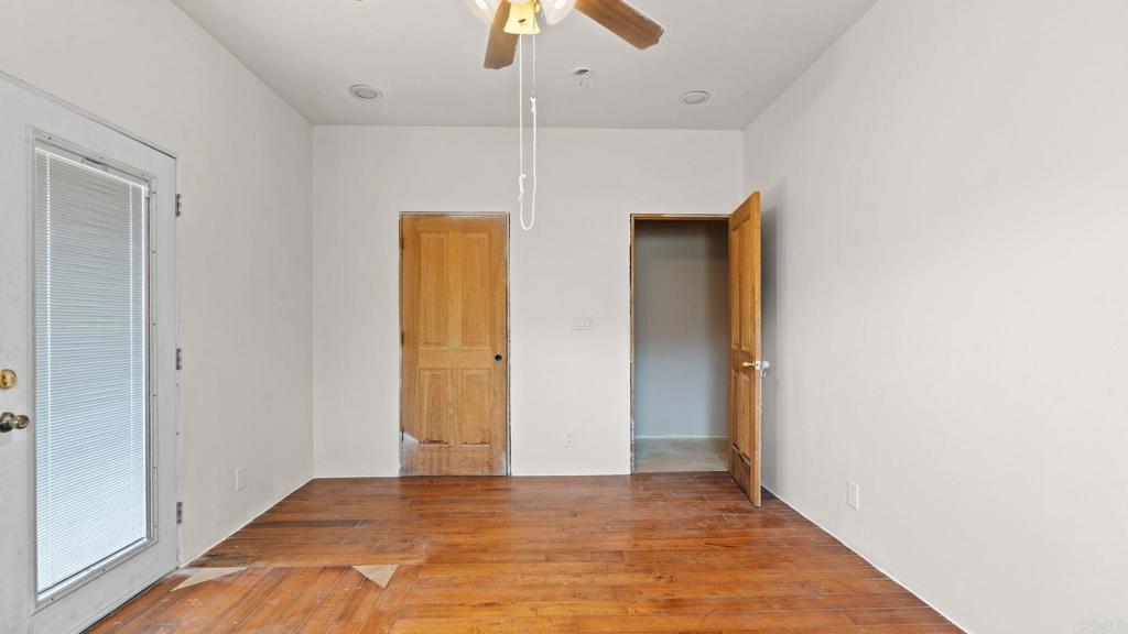 45620 Lewis Valley Road Hemet, CA 92544 - Photo 35 of 53 a view of an empty room with a ceiling fan
