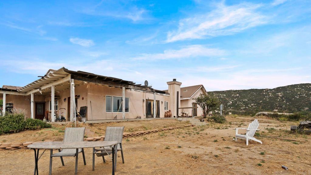 45620 Lewis Valley Road Hemet, CA 92544 - Photo 37 of 53 a view of a house with a yard