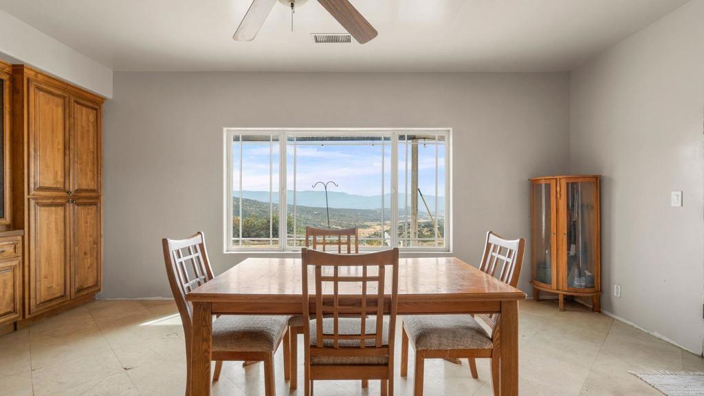 45620 Lewis Valley Road Hemet, CA 92544 - Photo 7 of 53 a view of a dining room with furniture window and outside view