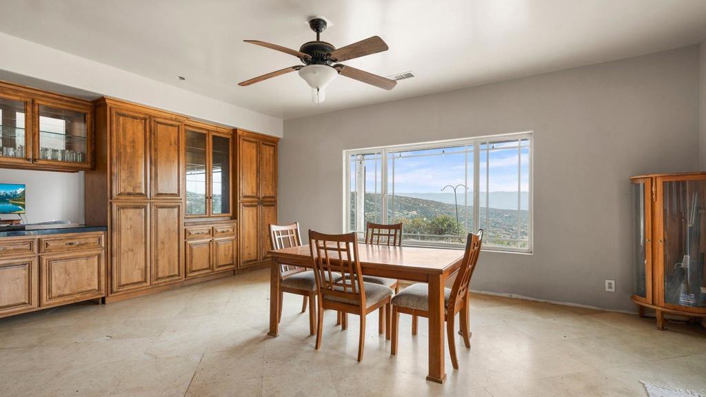 45620 Lewis Valley Road Hemet, CA 92544 - Photo 8 of 53 a dining room with furniture a livingroom and chandelier