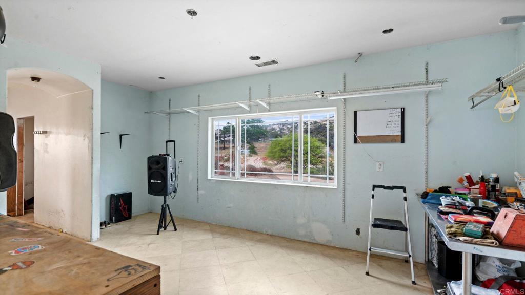 45620 Lewis Valley Road Hemet, CA 92544 - Photo 10 of 53 a view of a workspace with furniture and a window