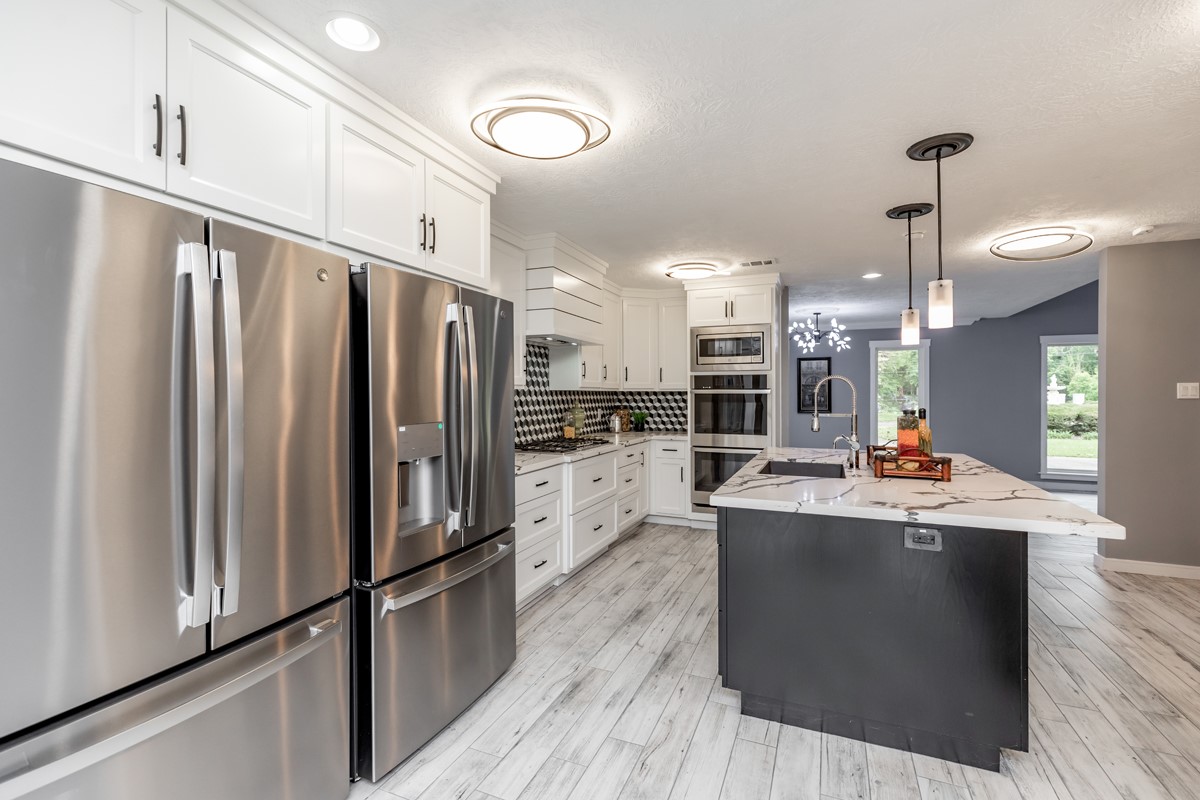 1380 Thomas Road Beaumont, TX 77706 - Photo 12 of 35 a kitchen with stainless steel appliances granite countertop a refrigerator and a stove