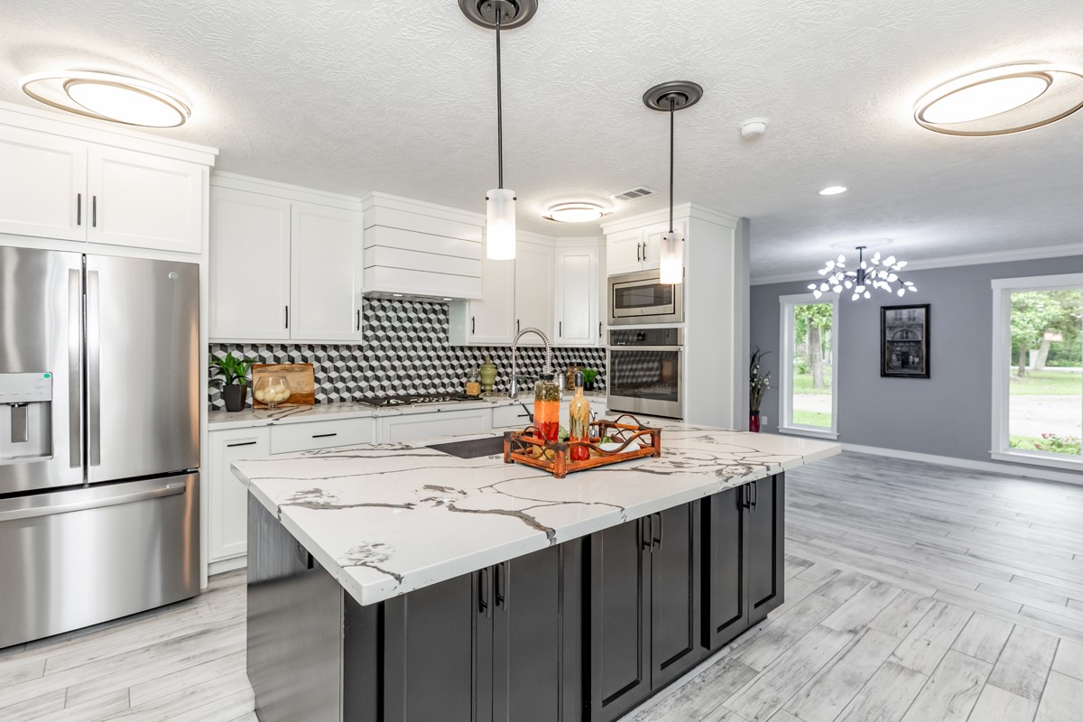 1380 Thomas Road Beaumont, TX 77706 - Photo 13 of 35 a kitchen with stainless steel appliances granite countertop a sink refrigerator and microwave