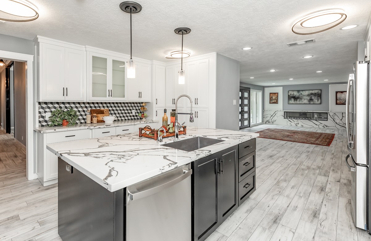 1380 Thomas Road Beaumont, TX 77706 - Photo 14 of 35 a kitchen with a stove a sink a refrigerator and a wooden floor