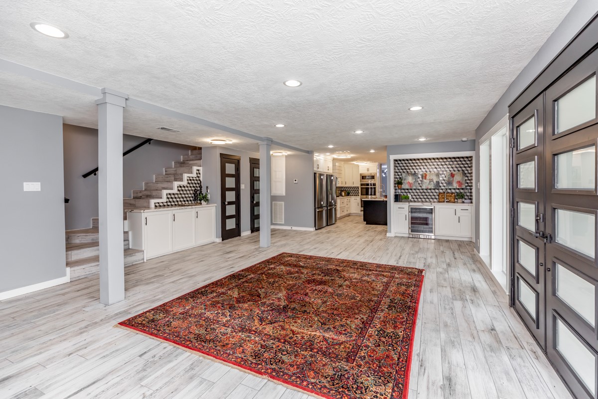 1380 Thomas Road Beaumont, TX 77706 - Photo 16 of 35 a living room with stainless steel appliances furniture wooden floor and a rug