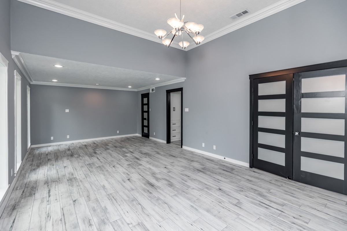 1380 Thomas Road Beaumont, TX 77706 - Photo 18 of 35 wooden floor in an empty room with a window