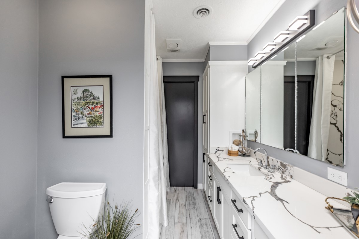 1380 Thomas Road Beaumont, TX 77706 - Photo 24 of 35 a bathroom with a double vanity sink toilet and shower