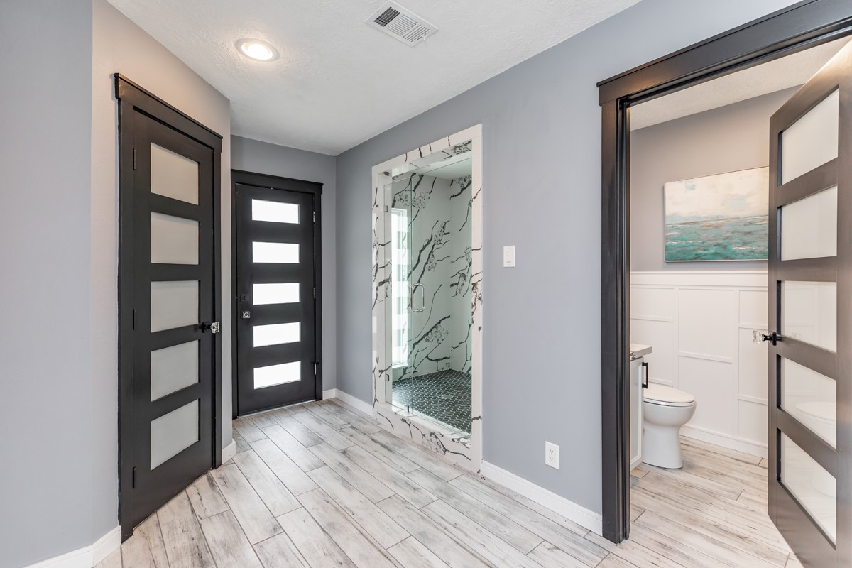 1380 Thomas Road Beaumont, TX 77706 - Photo 30 of 35 a view of a bathroom with a tub and glass door