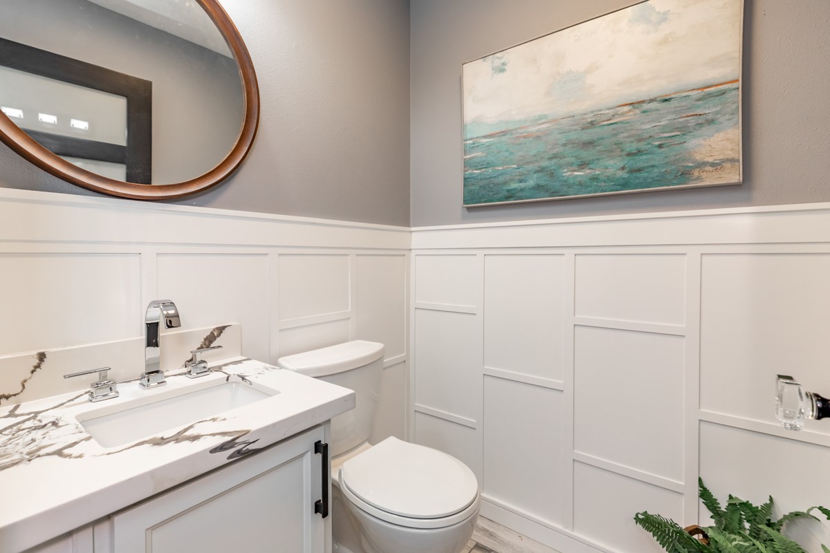 1380 Thomas Road Beaumont, TX 77706 - Photo 31 of 35 a bathroom with a granite countertop toilet sink and mirror