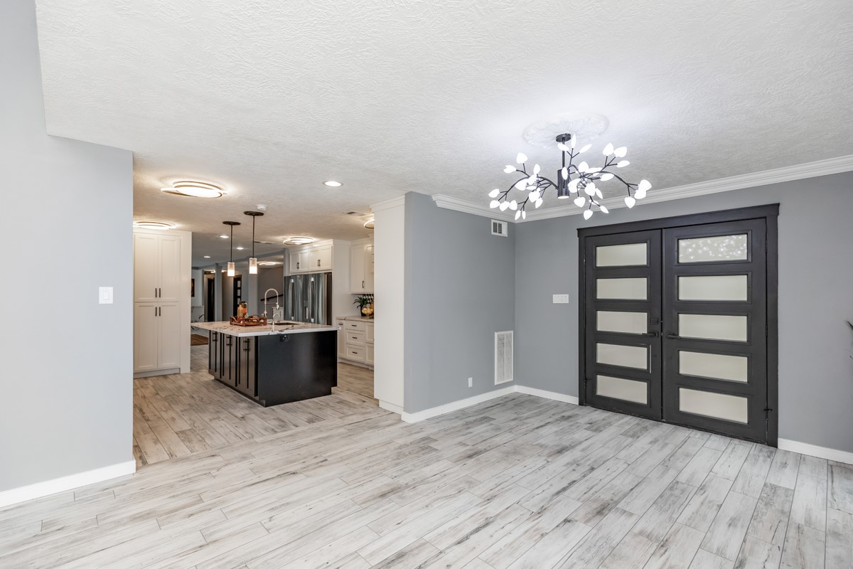 1380 Thomas Road Beaumont, TX 77706 - Photo 10 of 35 a view of a chandelier and wooden floor