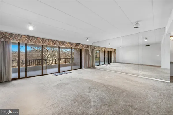 a view of an empty room with a sliding door