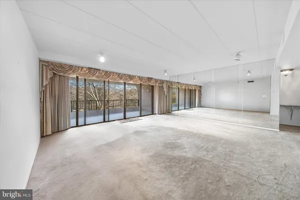 a view of an empty room with a sliding door