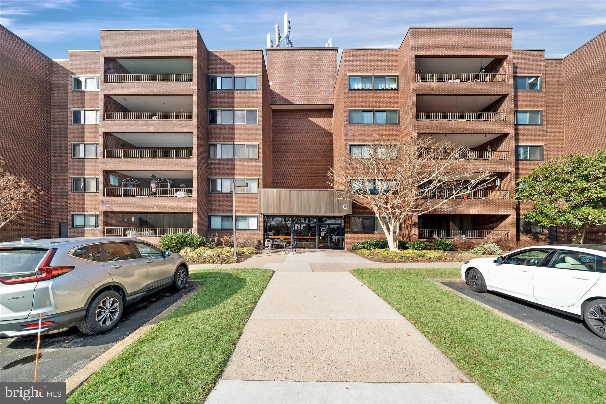 614 Loveville Road, Unit C04H Hockessin, DE 19707 - Photo 2 of 36 a view of a car parked in front of a building