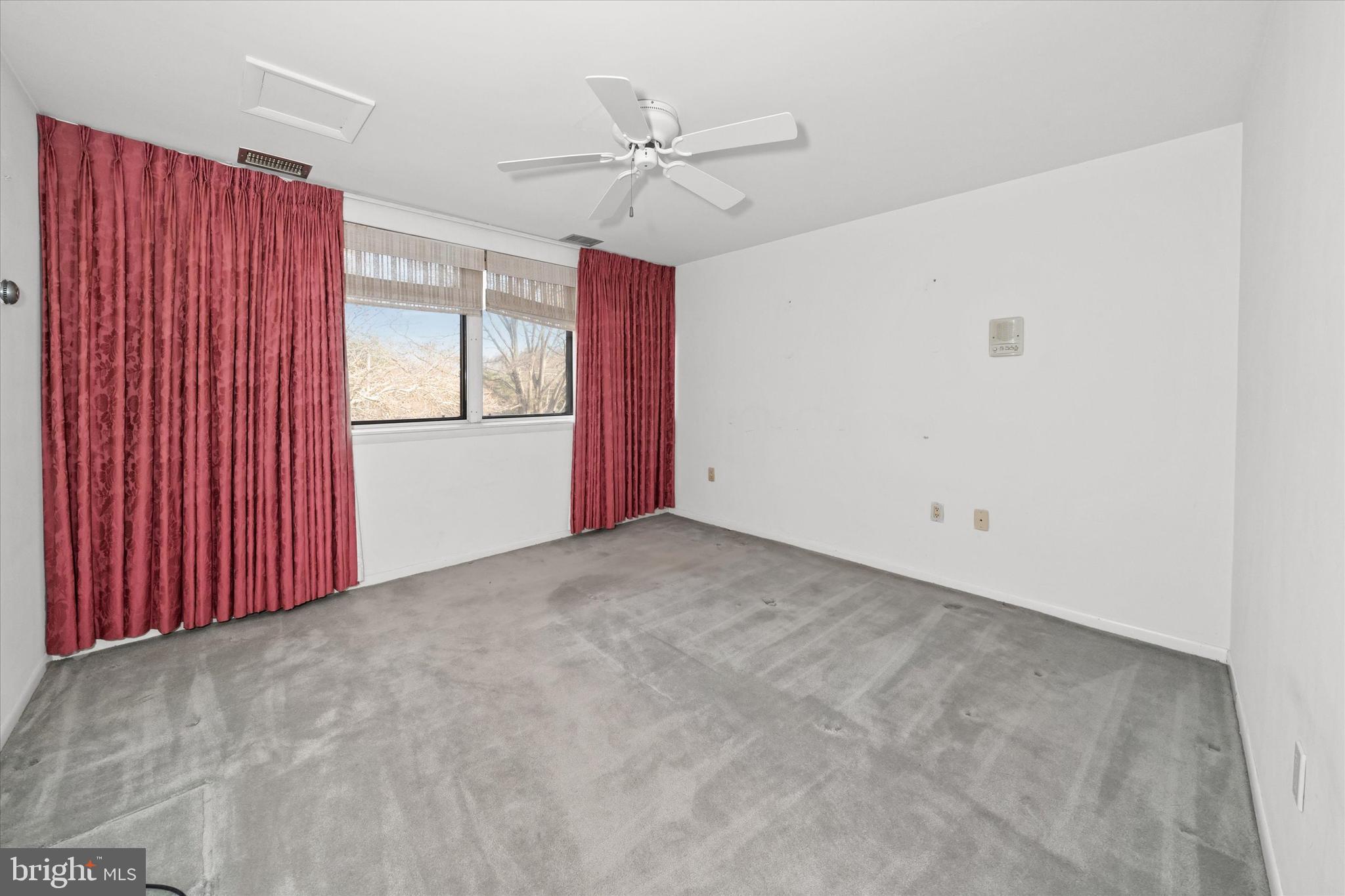 614 Loveville Road, Unit C04H Hockessin, DE 19707 - Photo 23 of 36 a view of a livingroom with a ceiling fan and window