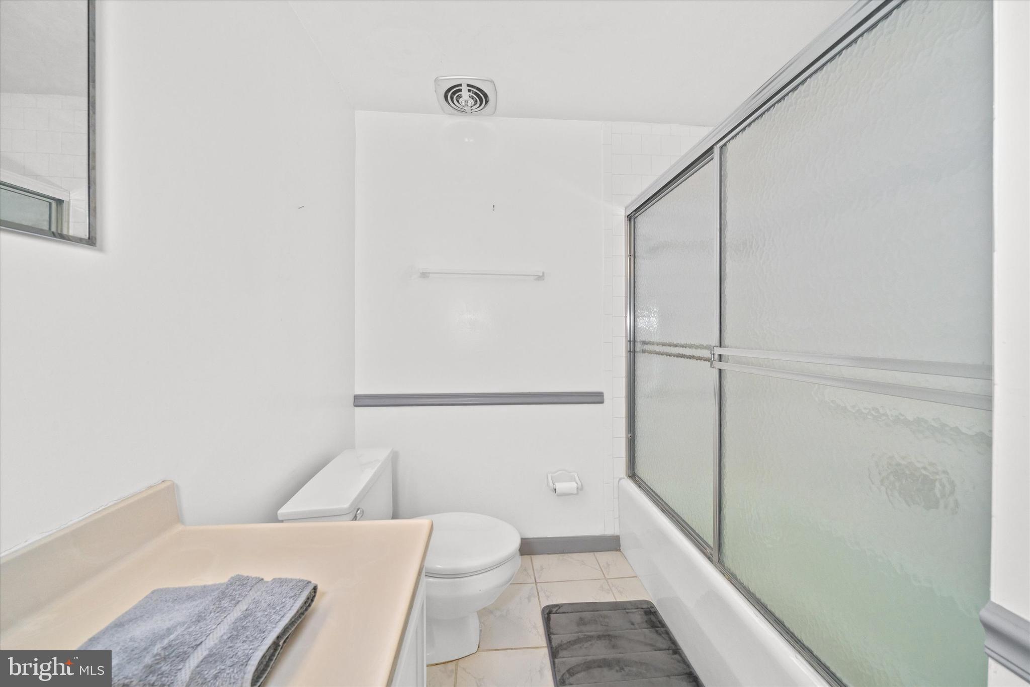 614 Loveville Road, Unit C04H Hockessin, DE 19707 - Photo 27 of 36 a bathroom with a toilet and a shower