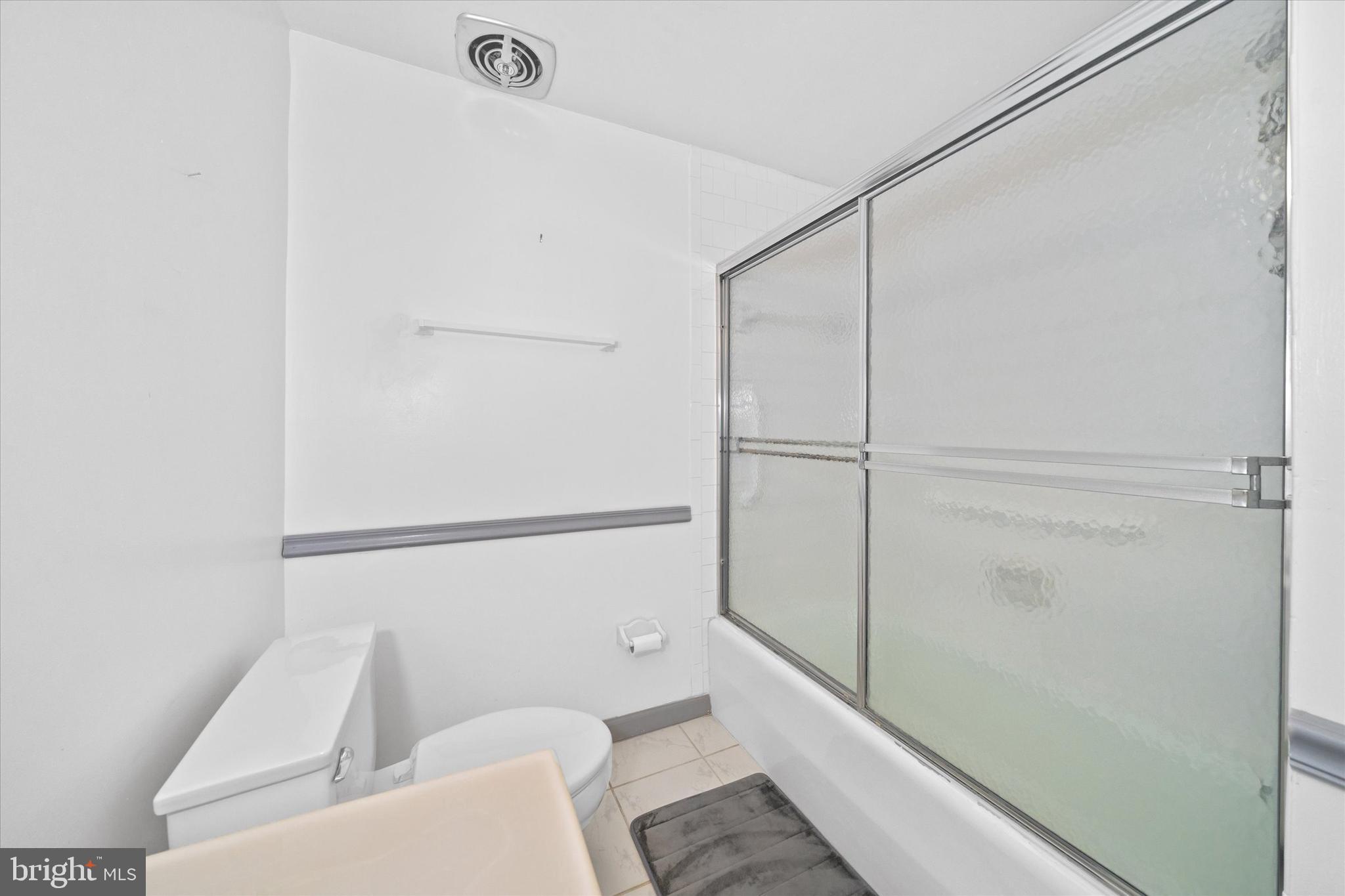 614 Loveville Road, Unit C04H Hockessin, DE 19707 - Photo 28 of 36 a bathroom with a shower and a toilet