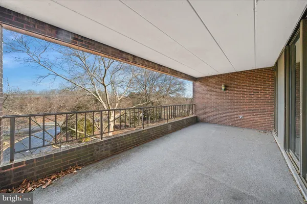 a view of an empty room with windows