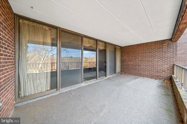 a view of an empty room with a sliding door