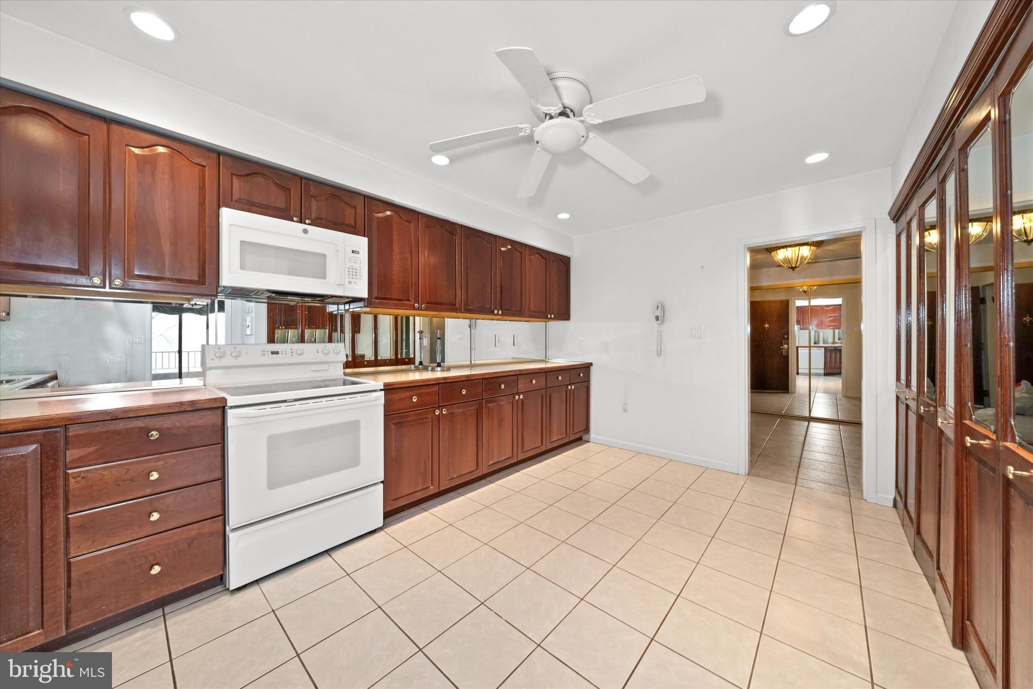614 Loveville Road, Unit C04H Hockessin, DE 19707 - Photo 9 of 36 a kitchen with a cabinets and chandelier