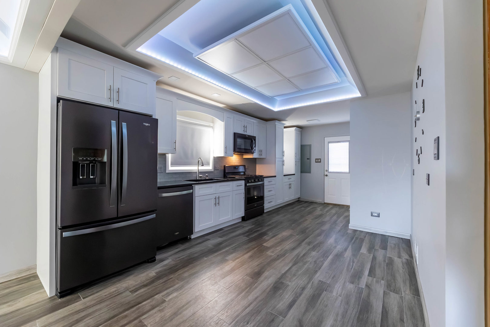 7806 West 83rd Street Bridgeview, IL 60455 - Photo 17 of 53 a kitchen with stainless steel appliances granite countertop a refrigerator and a stove