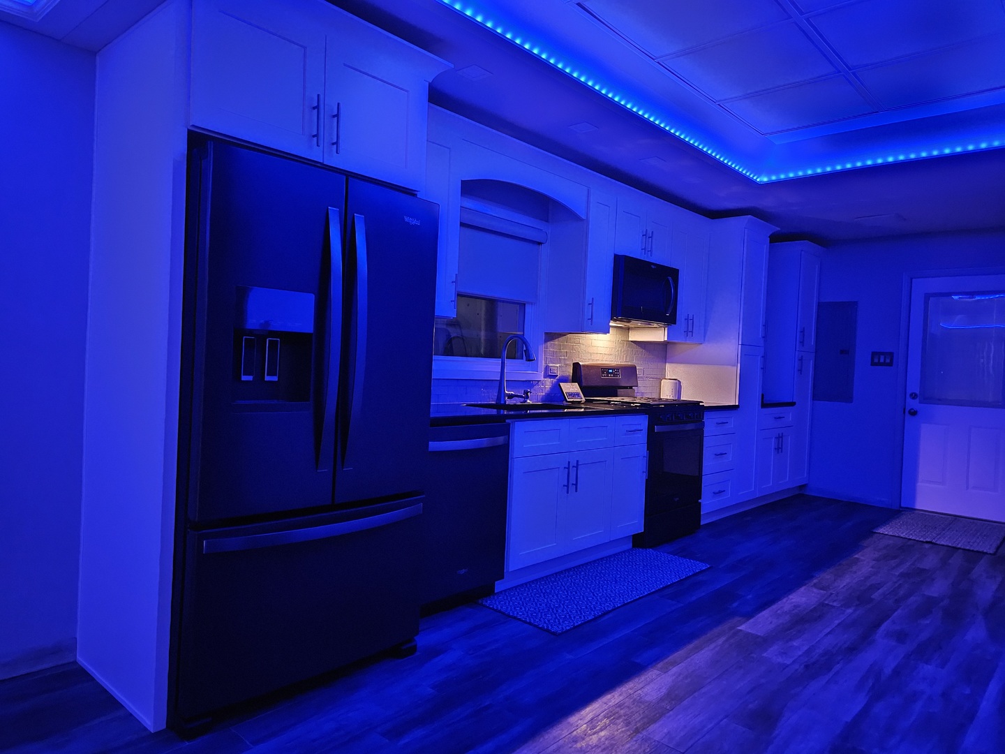 7806 West 83rd Street Bridgeview, IL 60455 - Photo 33 of 53 a kitchen with wooden floors and wooden cabinets