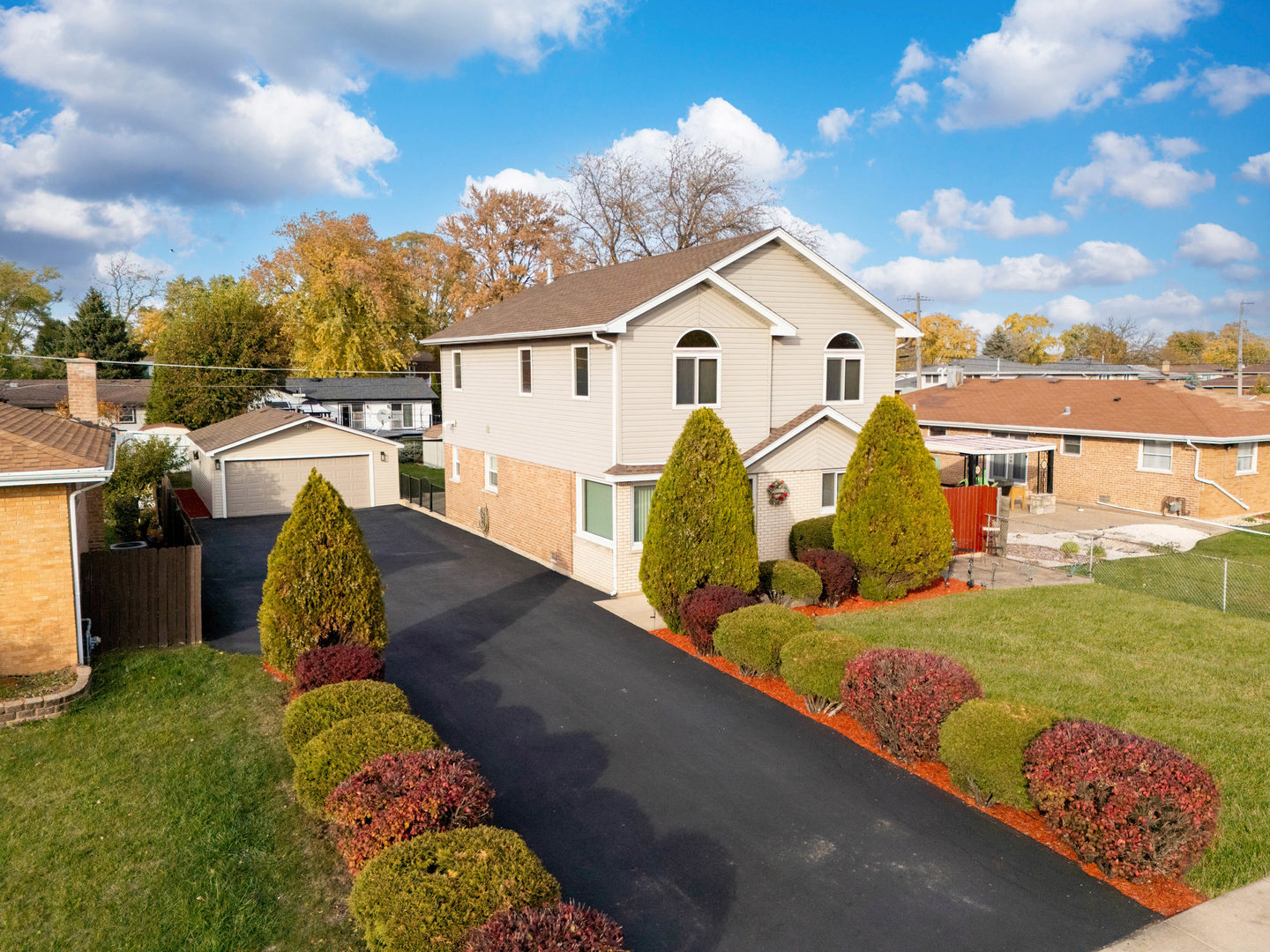 7806 West 83rd Street Bridgeview, IL 60455 - Photo 4 of 53 a view of a white house with a yard