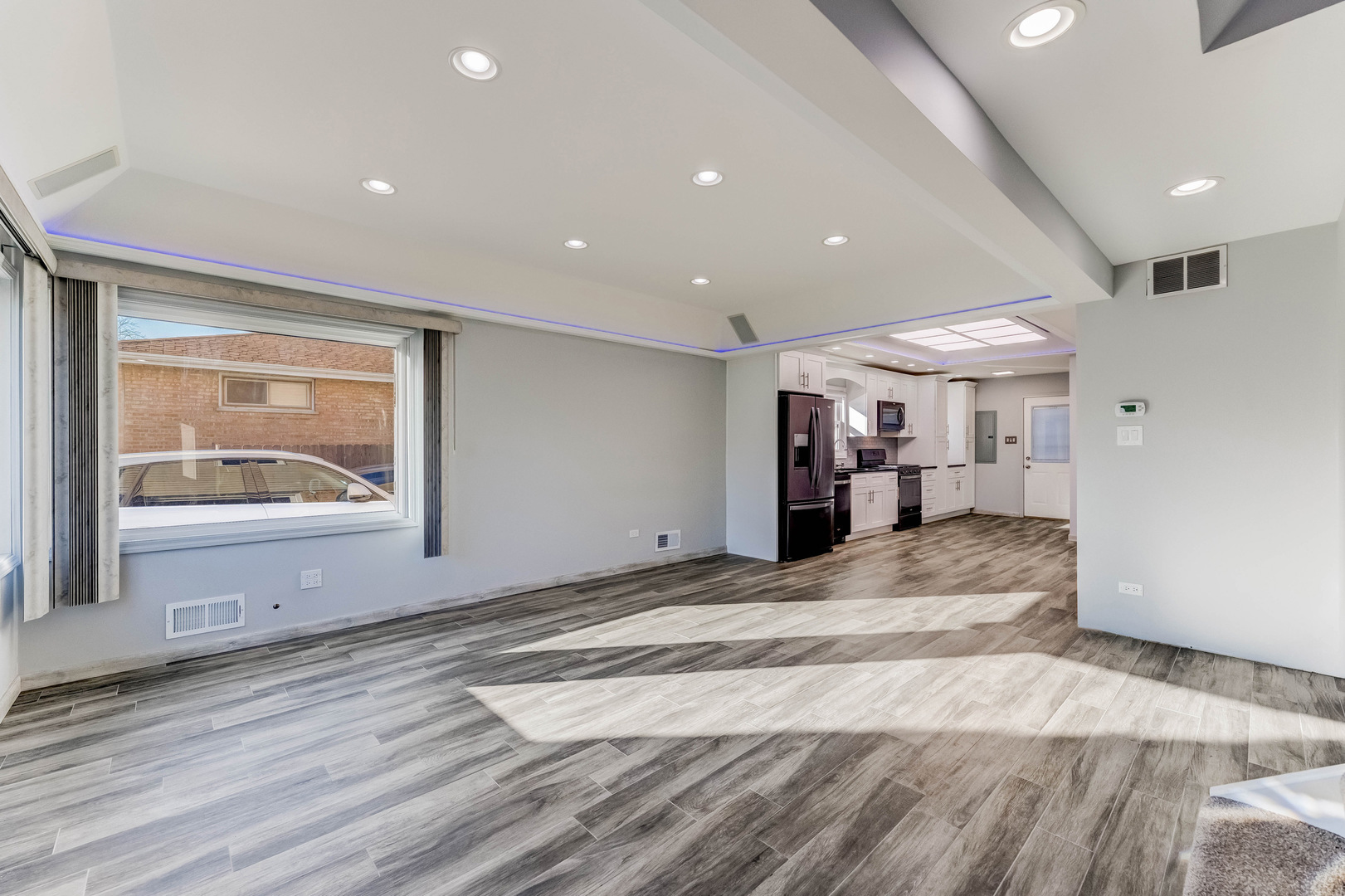 7806 West 83rd Street Bridgeview, IL 60455 - Photo 7 of 53 a view of a room with wooden floor and window