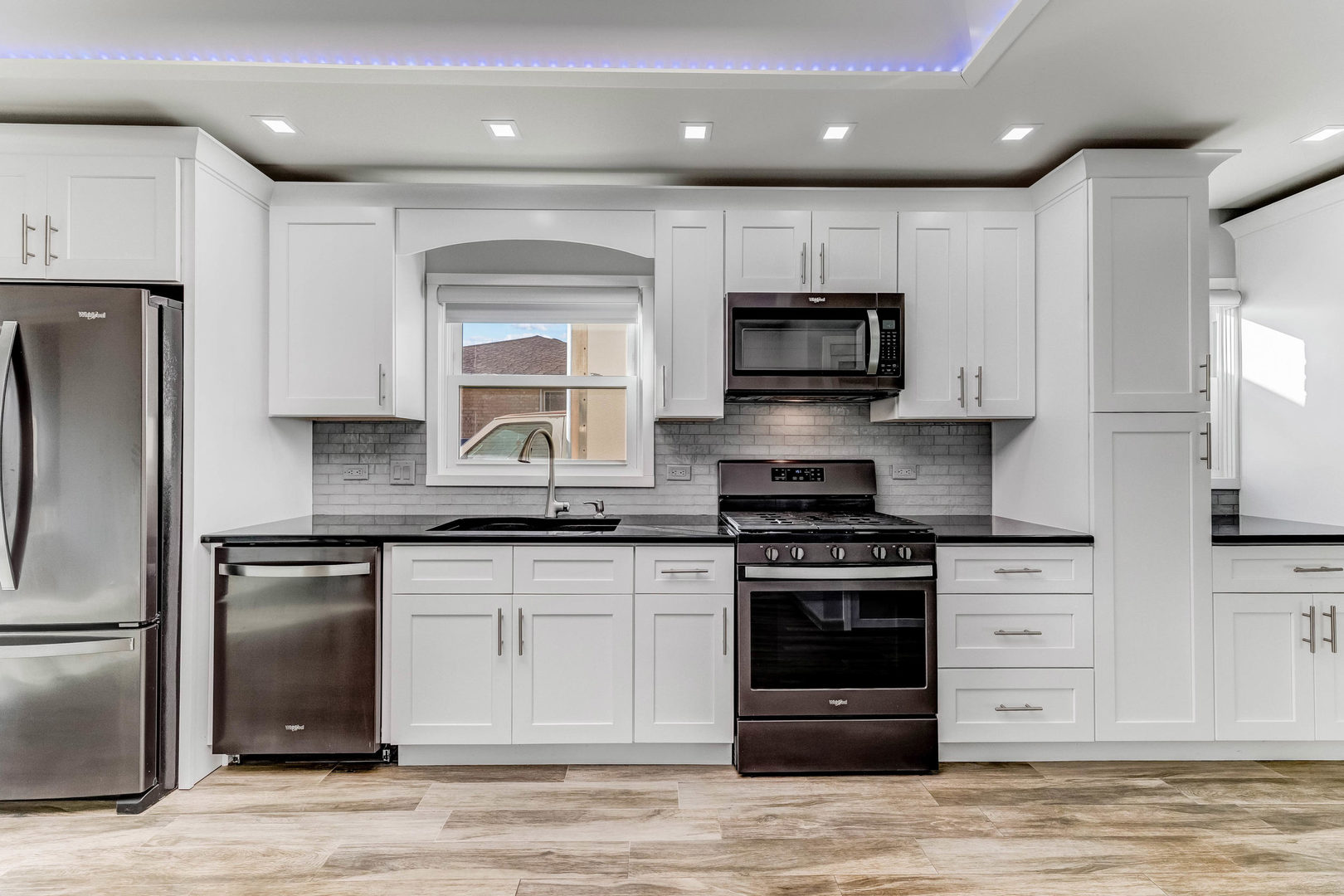7806 West 83rd Street Bridgeview, IL 60455 - Photo 8 of 53 a kitchen with stainless steel appliances granite countertop a stove a sink and a microwave