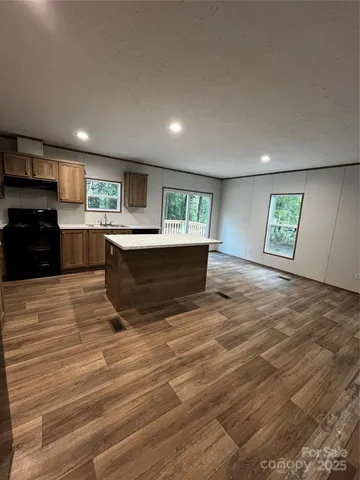 a view of kitchen and kitchen with electric equipment