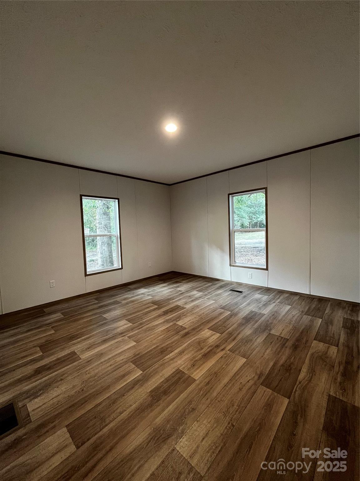 181 Duncan Road Pageland, SC 29728 - Photo 8 of 11 an empty room with windows
