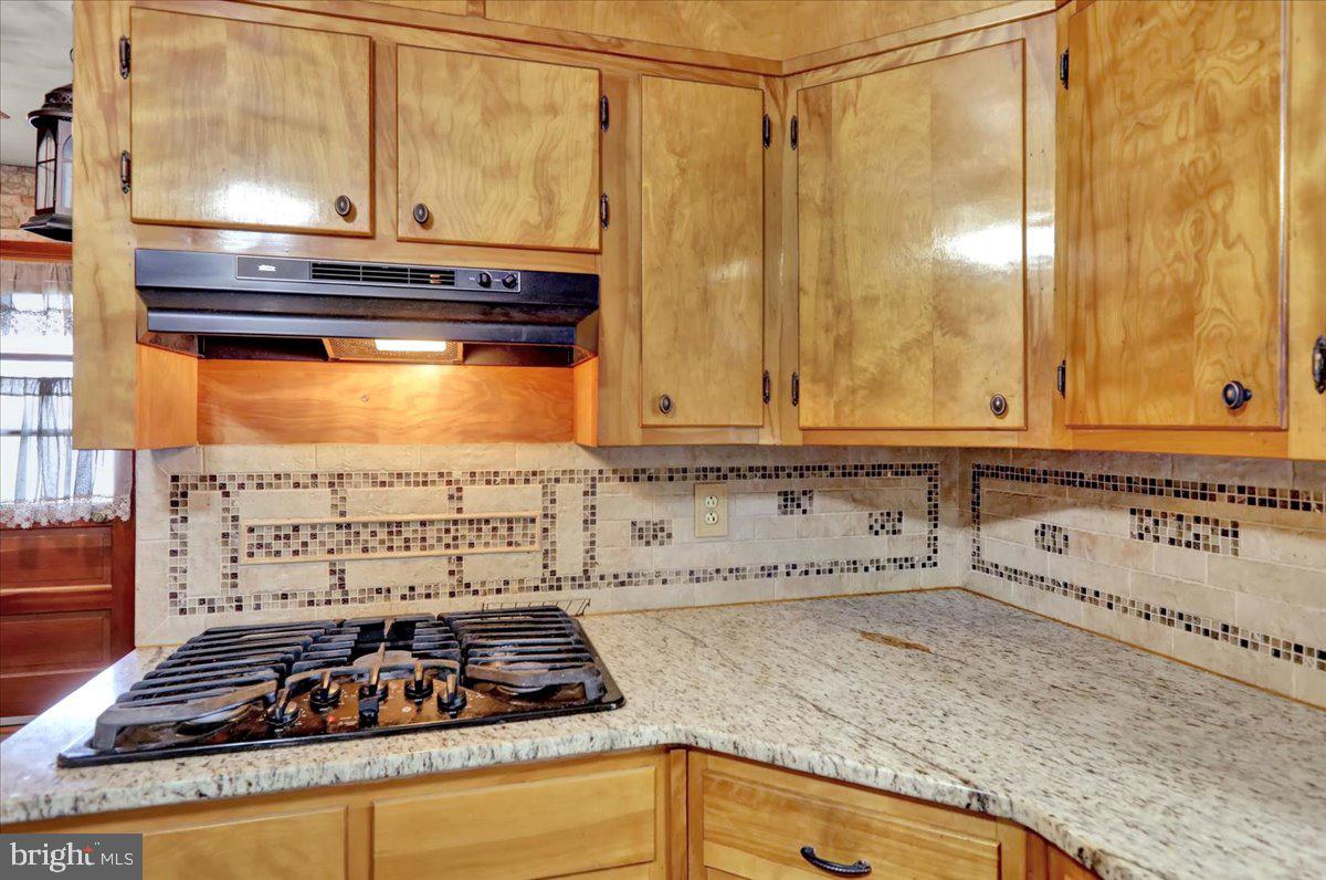 508 American Legion Boulevard Pine Grove, PA 17963 - Photo 12 of 40 a bathroom with a granite countertop sink and a mirror