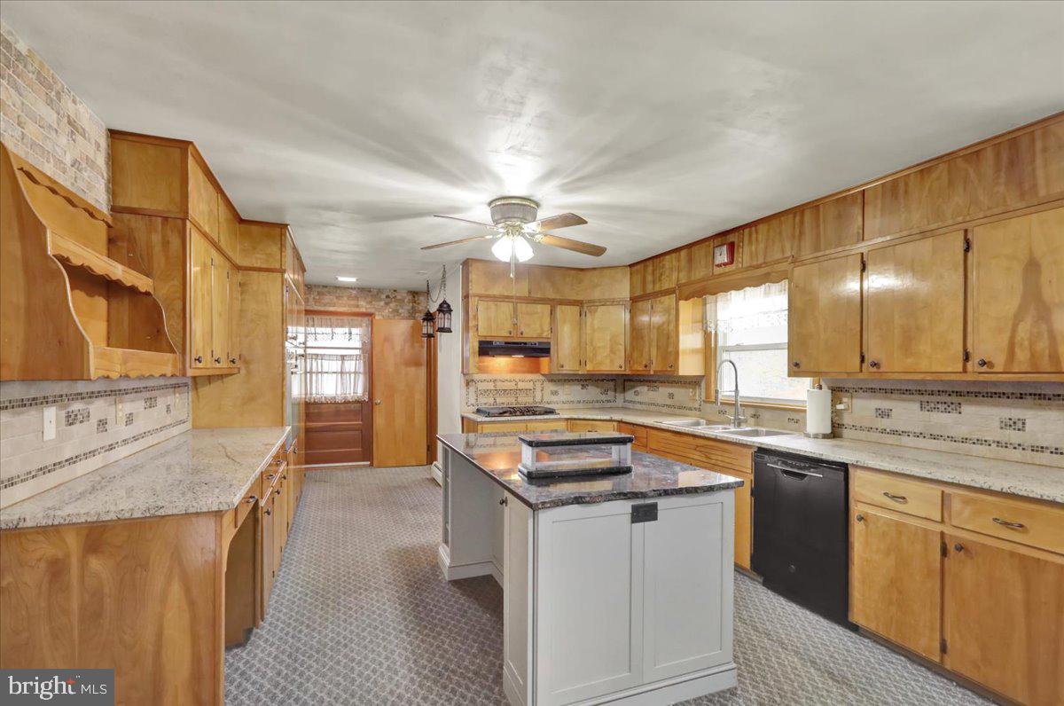 508 American Legion Boulevard Pine Grove, PA 17963 - Photo 13 of 40 a kitchen with stainless steel appliances granite countertop a sink stove and refrigerator