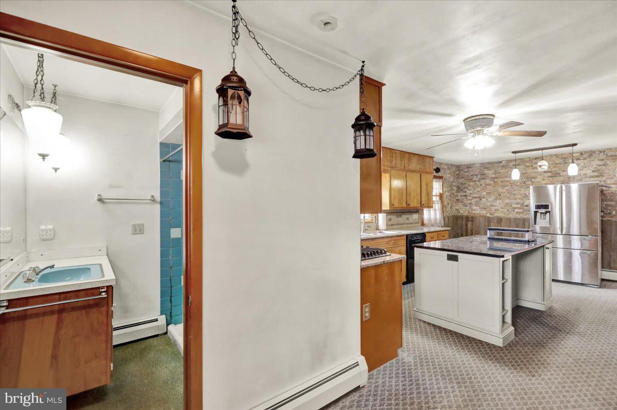 508 American Legion Boulevard Pine Grove, PA 17963 - Photo 14 of 40 a kitchen with stainless steel appliances granite countertop a refrigerator and a stove top oven
